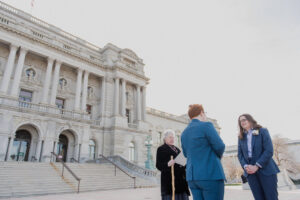 gay couple reading wedding vows at library of congress steps